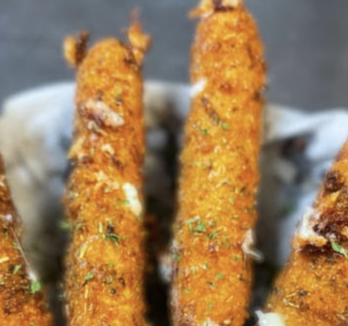 The Blind Mule signature dishes Fried Cheese PlanksThe Old Lady Hayes SaladClassic Po' Boy